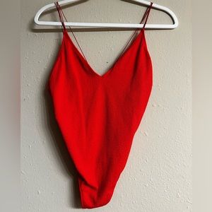 Get bendy in this bright Orange strapping back onside or pair it with jeans